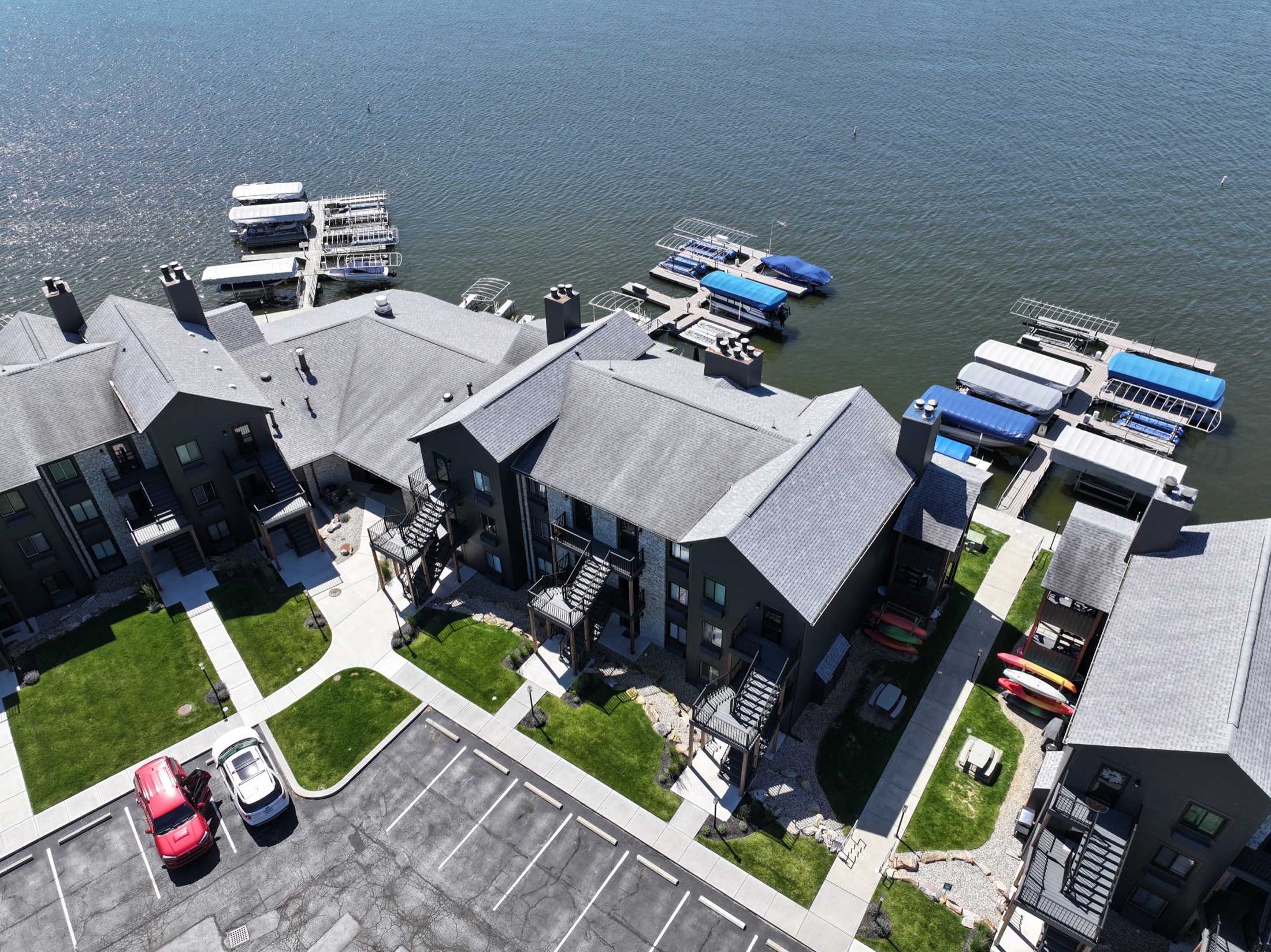 Aerial view of the Clarendon Drive condominium roofs beside the water