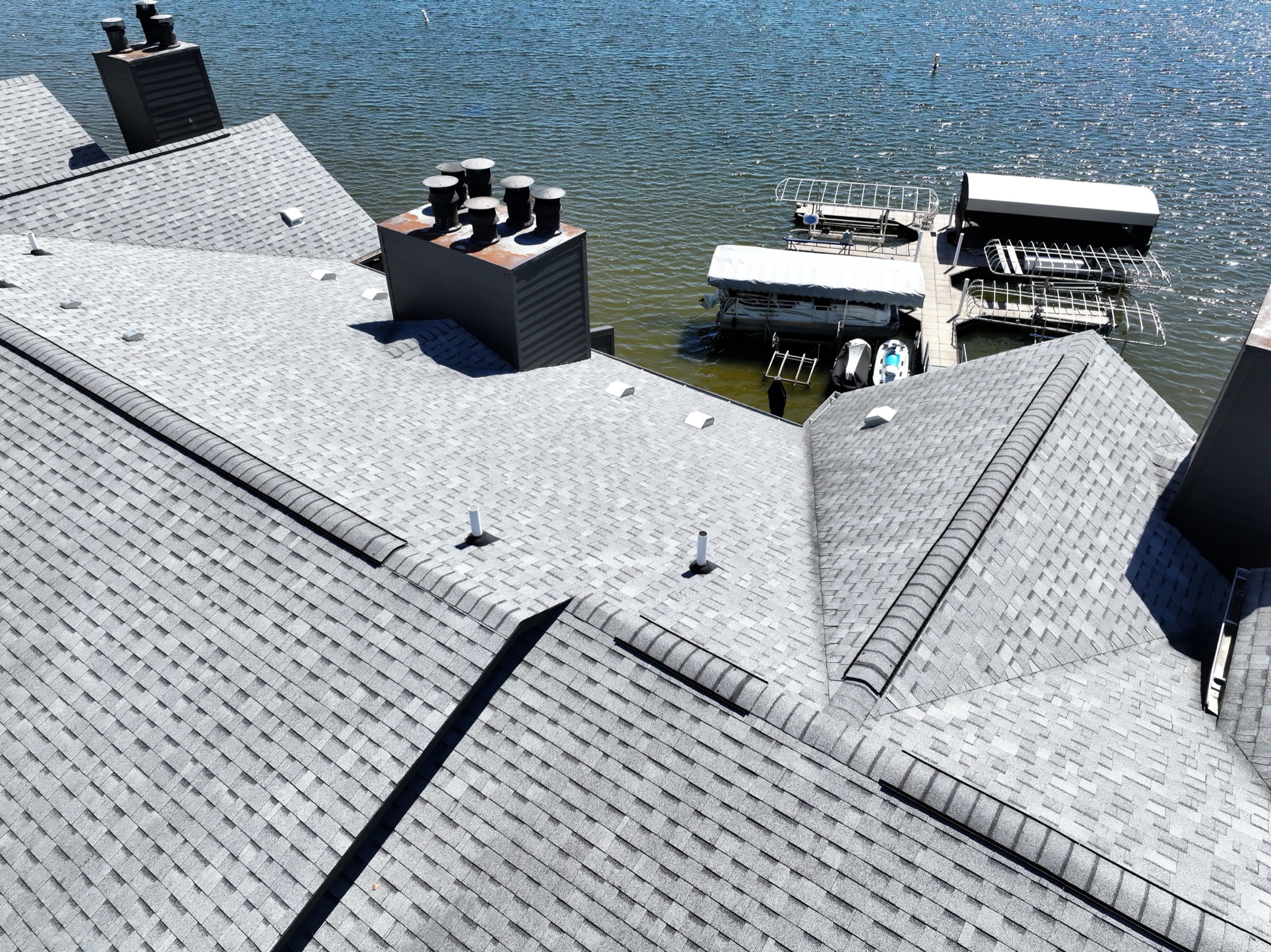 Lake-side aerial view of the roof at 102 Clarendon Drive in Noblesville